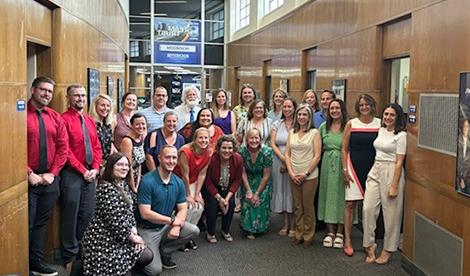 The scholarship winners smile in a large group